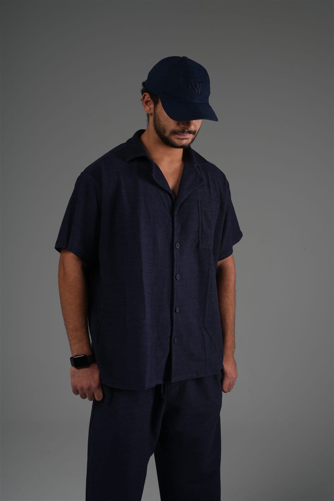 Model in the navy Riva terry camp shirt