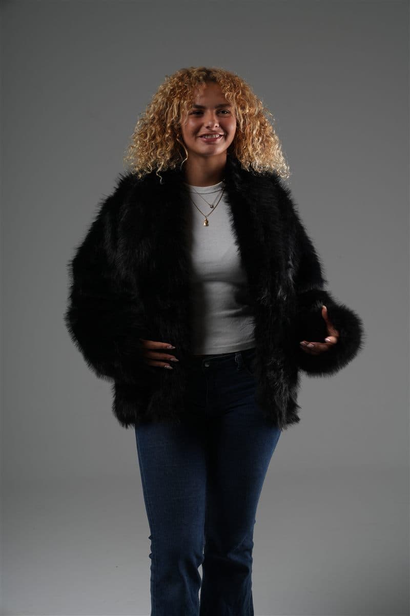 Model in the Kohl faux fox jacket over a white tee and jeans